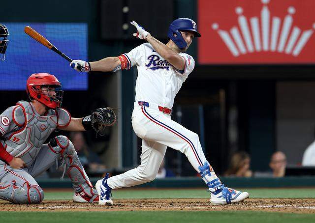 Texas Rangers outfielder Evan Carter hits a double in the second inning against the Cincinnati Reds on Friday, April 3, 2026.